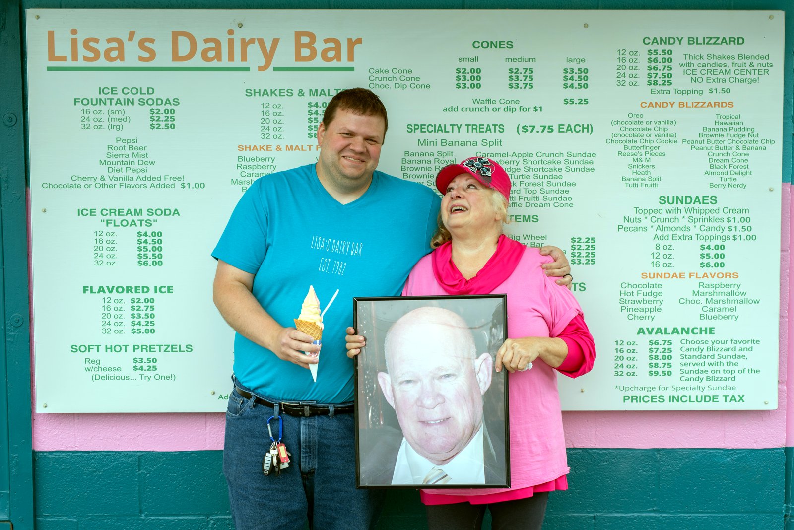 The family with a cherished portrait at the shop